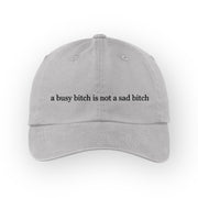 A busy bitch is not a sad bitch” cap